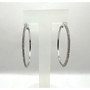 Medium sized silver-toned circular hoops lined with rhinestones